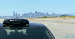 Photo of roof sensor on vehicle with city skyline in background